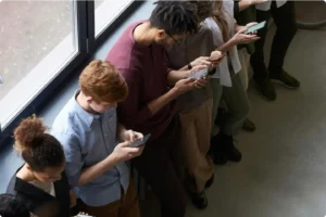 Group of people using smartphones to access digital telehealth services from DirectDoc in South Africa