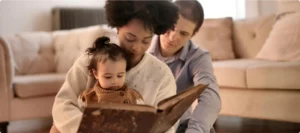 Family reading a book together in a cozy living room, supported by DirectDoc online doctor services in South Africa